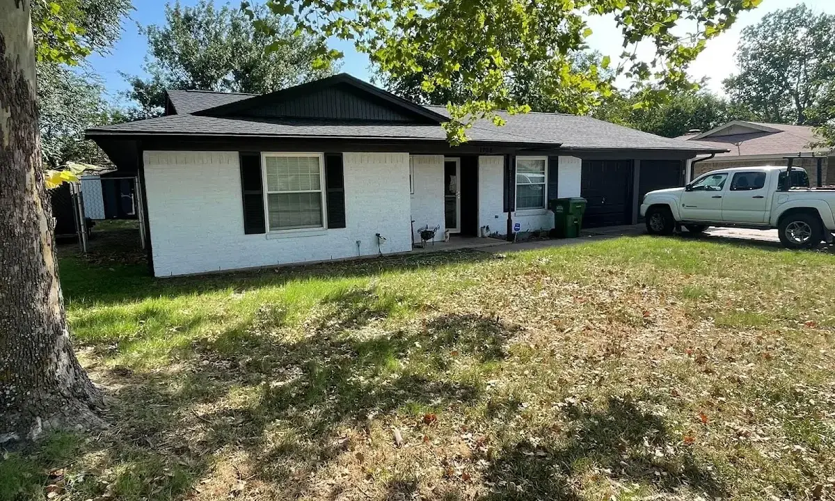 Professional roofing crew working on a residential roof in Farmers Branch